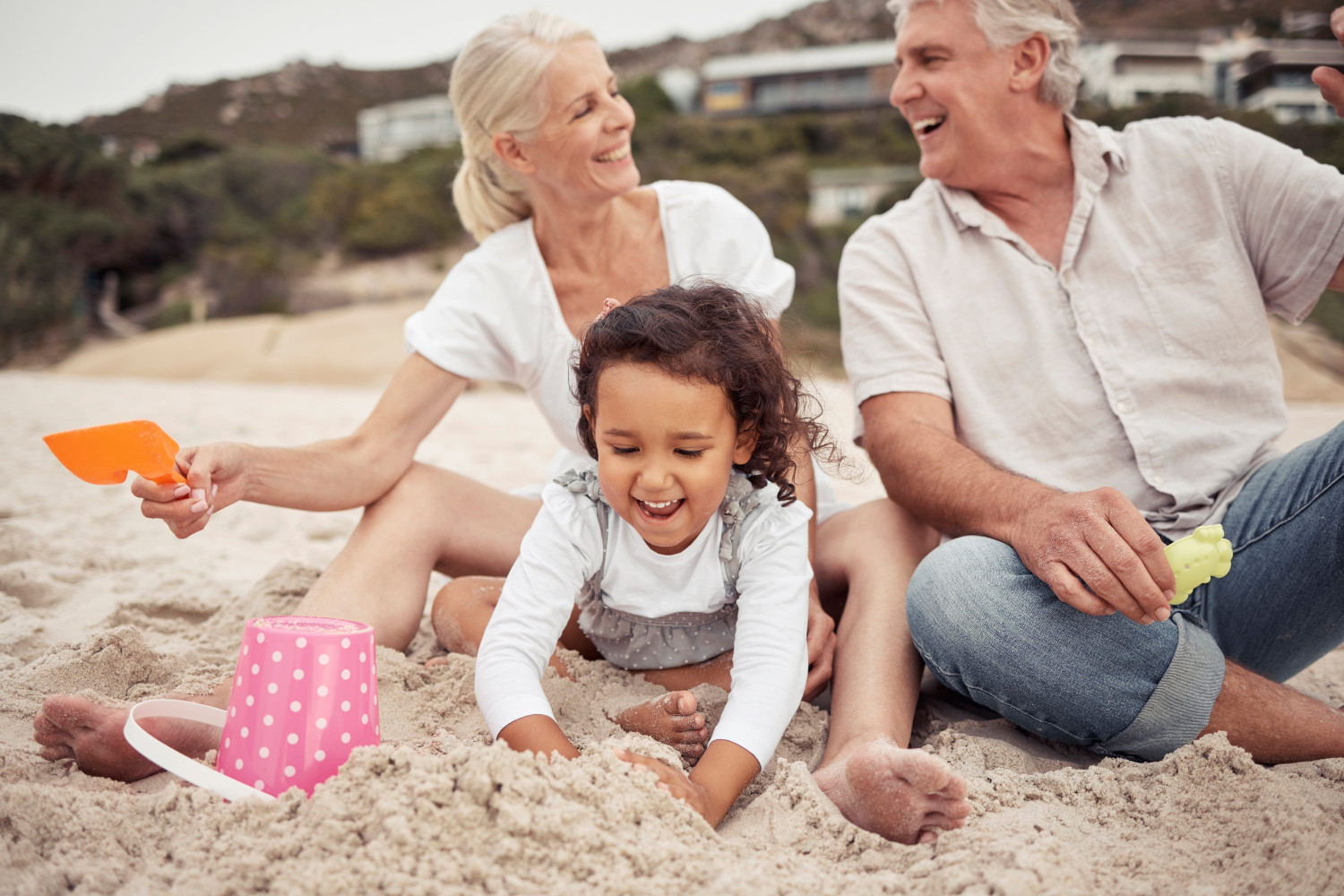 family,,beach,and,a,girl,and,her,grandparents,playing,in