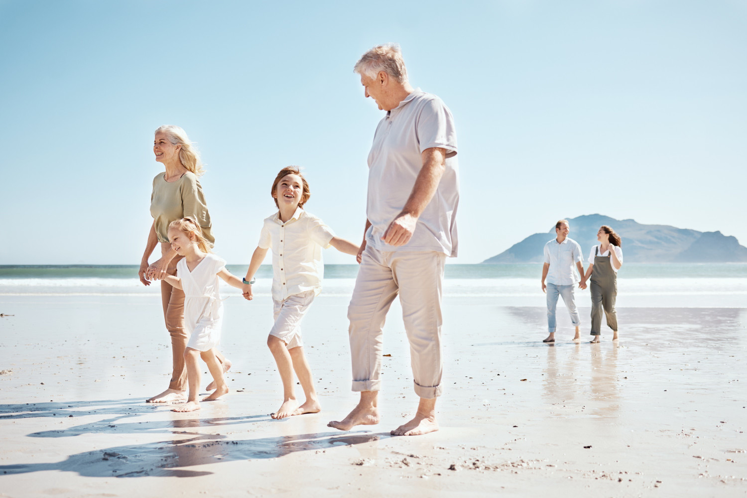 grandparents,,kids,and,holding,hands,on,beach,,family,and,parents