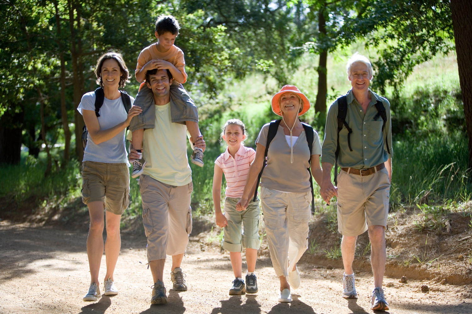 horizontal,shot,of,a,multi generational,family,with,boy,on,the