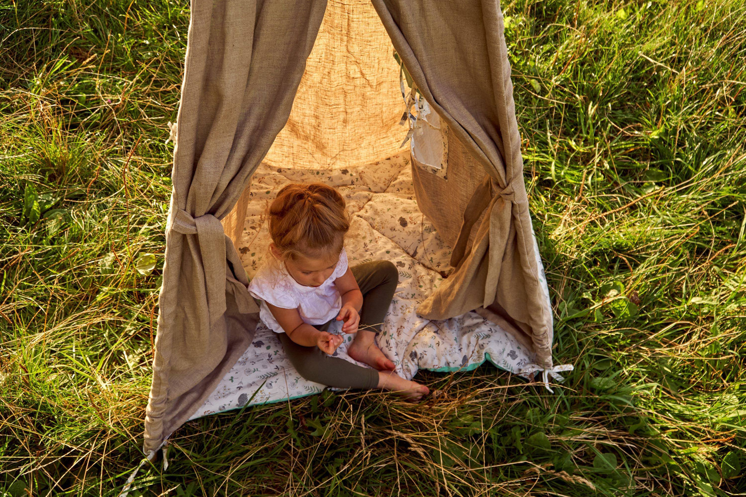 girl,at,sunset,in,nature.,wigwam,by,the,lake.,new