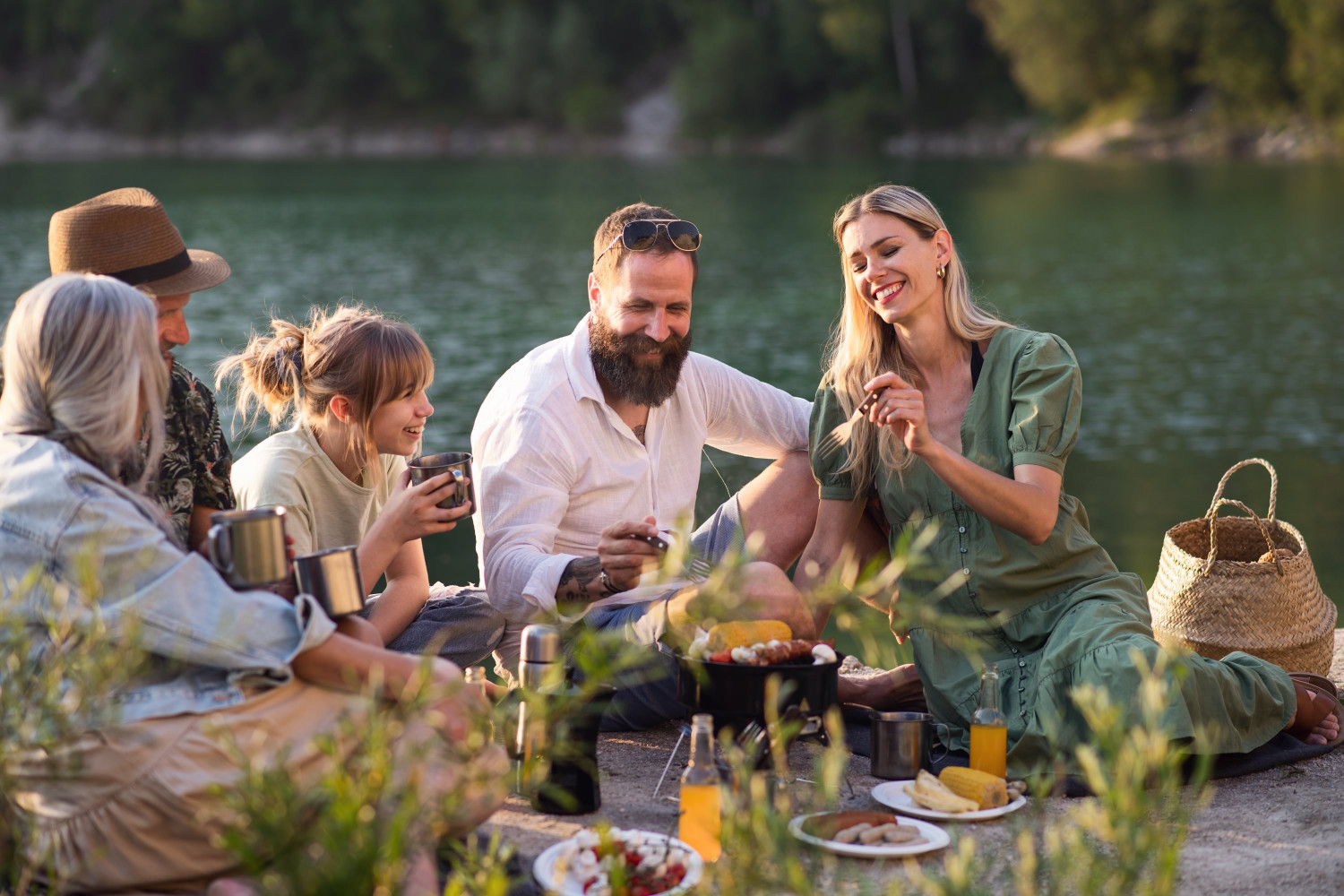 happy,multigeneration,family,on,summer,holiday,trip,,barbecue,by,lake.